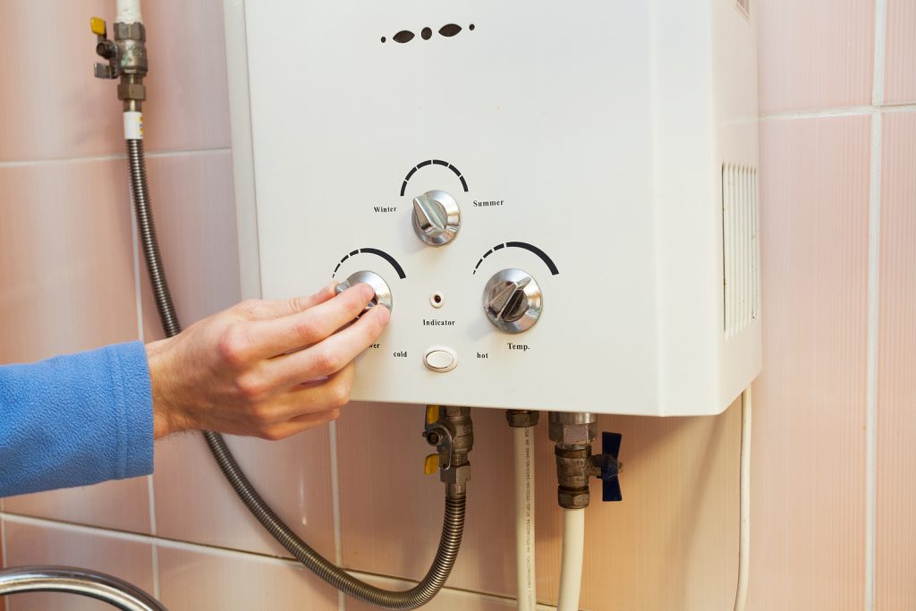 Hand configuring a hot water cylinder system